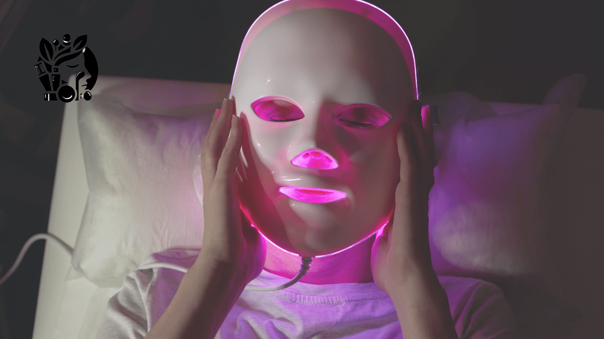 Person using a glowing LED face mask for anti-aging red light therapy at home