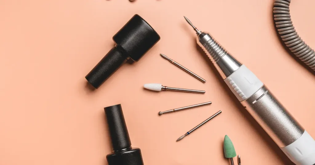 Nail art tools flatlay with brushes and polish for fine line nail art