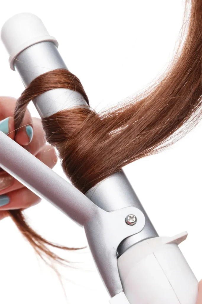 rotating curling iron creating smooth long lasting curls