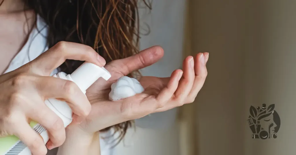 applying mousse to damp hair to help curls last longer